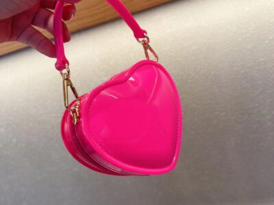Cute Heart Cherry BagTurn heads and spread love everywhere you go with the Cute Heart Jelly Bag! This adorable piece, shaped like a heart and crafted from glossy jelly material, is the perfect accessory for fashion-forward young ladies. Designed to add a touch of sweetness to any outfit, the Cute Heart Jelly Bag is not just a bag—it’s a little pop of joy!